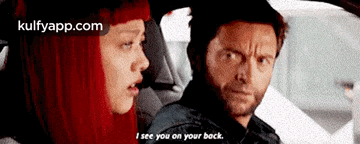 a man and a woman are sitting in a car and the man says i see you on your back