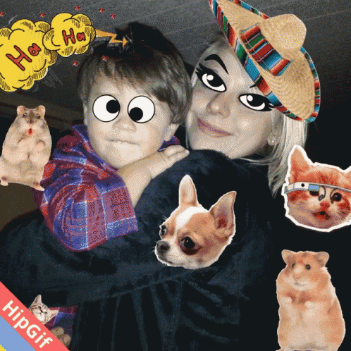 a woman is holding a child with a cartoon face on his face and a speech bubble that says " ha ha "