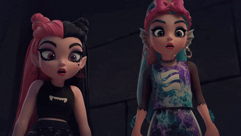 two monster high dolls standing next to each other in a dark room