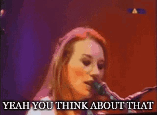 a woman singing into a microphone with the words " yeah you think about that " below her
