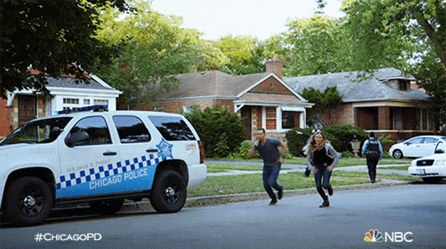 a chicago police suv is parked in front of a brick house