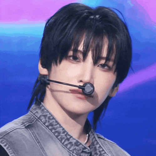 a close up of a person 's face with a microphone around their mouth