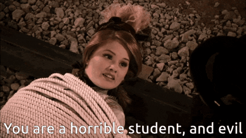 a woman is tied up with a rope and the words " you are a horrible student and evil " are next to her