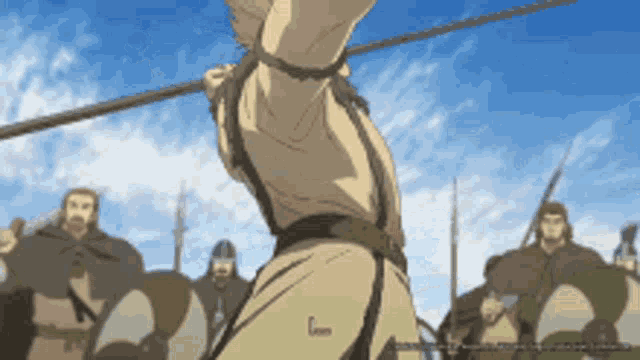 a man is tied up with a rope and is holding a stick in his hand .