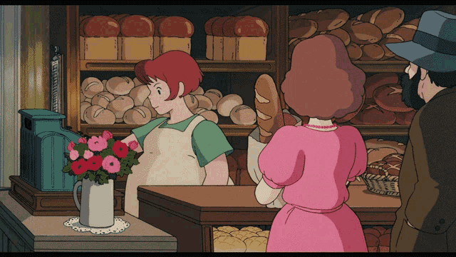 a woman in a pink dress holds a loaf of bread