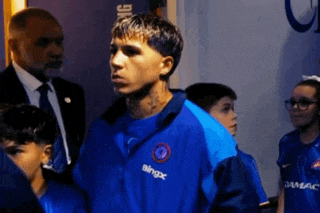 a man wearing a blue jacket that says bingx