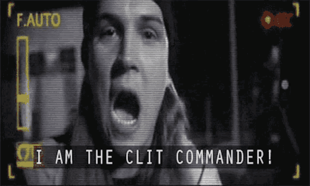 a video of a man screaming with the words " i am the clit commander " below him