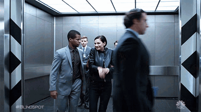 a group of people are walking in an elevator with the hashtag #blindspot