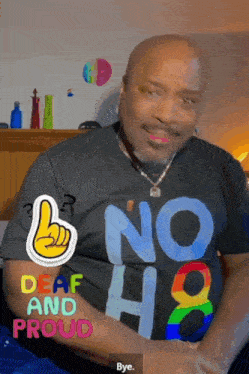a man wearing a shirt that says " no deaf and proud "