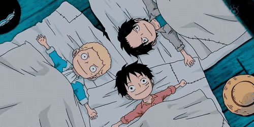 three cartoon characters laying on a bed with a straw hat in the background