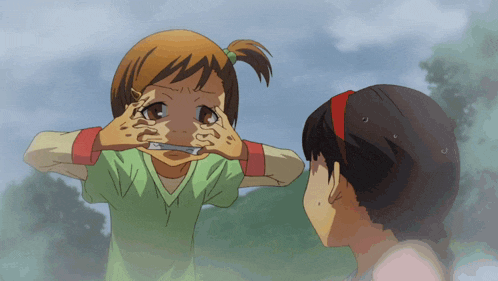 a little girl is covering her eyes with her hands
