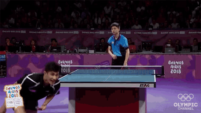 a ping pong game is being played at the buenos aires 2018 olympic channel