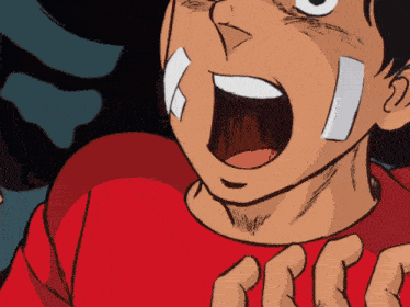 a close up of a person 's face with a red shirt on