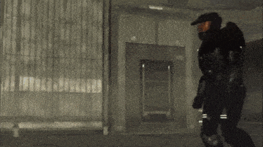 a man in a military uniform is walking through a dark room