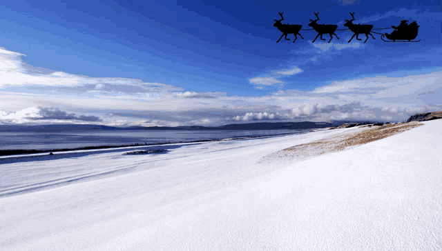 a sleigh pulled by three reindeer is flying over a snowy field