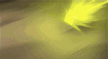 a yellow light is coming out of a dark area