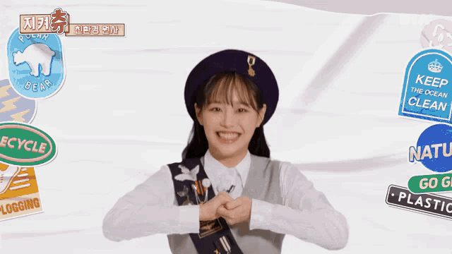 a girl in a beret with a sticker that says recycle