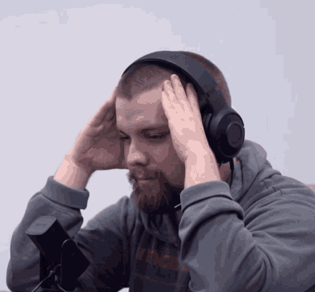 a man wearing headphones and a shirt that says intel on it