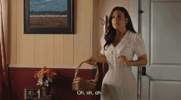 a woman holding a basket says oh oh oh