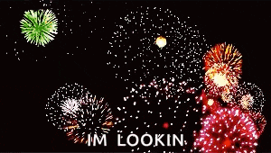 a bunch of fireworks are displayed in the night sky with the words im lookin below them