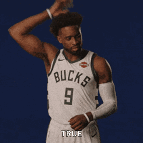 a man in a bucks jersey is dancing