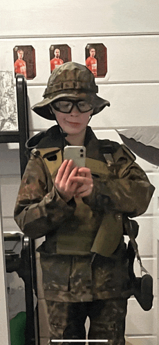 a person in a military uniform taking a picture of themselves