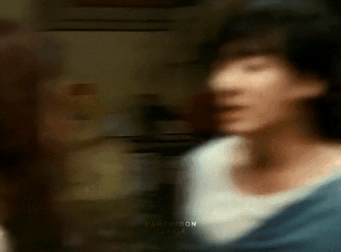 a blurry picture of a man and a woman with the word tumblr on the bottom right corner