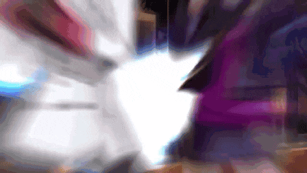 a blurry image of a person 's face with a purple background .