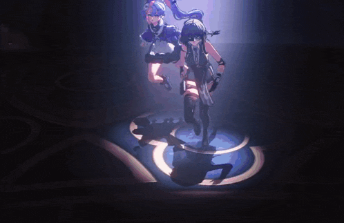 a couple of girls are standing in a dark room with a spotlight on them