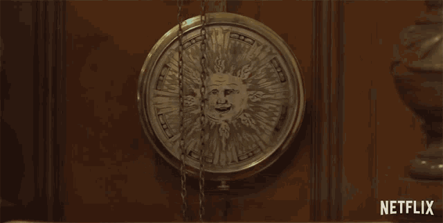 a clock with a face on it is hanging on a wall next to a sign that says netflix