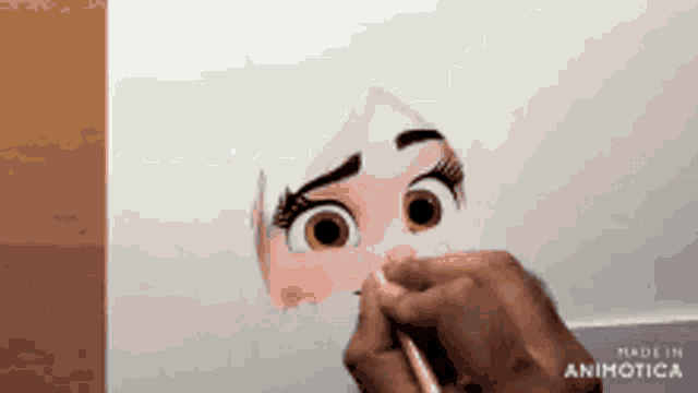 a person is drawing a girl 's face with a pencil