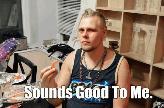 a man wearing a tank top that says " sounds good to me "