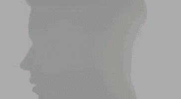 a shadow of a person 's face is visible on a white background .