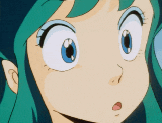 a close up of a girl 's face with blue eyes and green hair