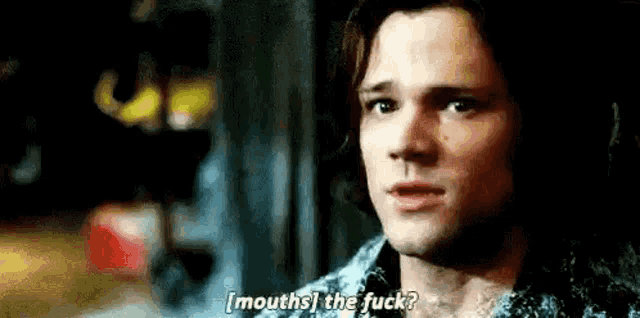 a close up of a man 's face with the words `` mouths the fuck '' written above him .