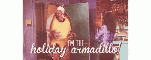 a man in a armadillo costume is standing in front of a woman