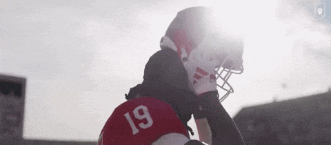 a football player with the number 19 on his jersey is wearing a helmet