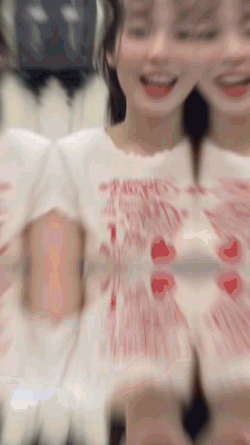 a blurry picture of a girl wearing a t-shirt that says ' happiness is always ' on it