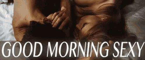a man and a woman are laying on a bed with the words " good morning sexy " below them