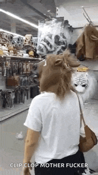 a woman wearing a horse mask is walking down a store aisle .