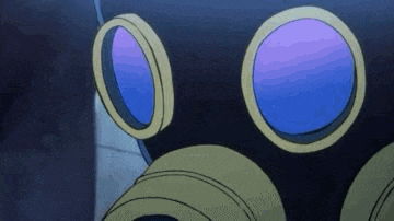 a close up of a person wearing a gas mask with blue goggles .