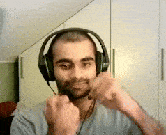 a man is wearing headphones and making a funny face