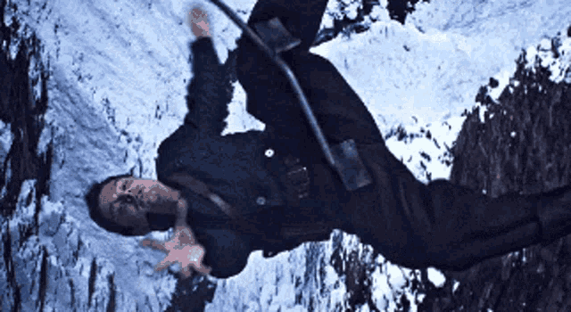 a man is upside down in the snow