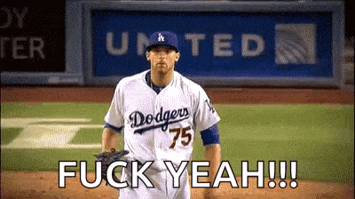 a dodgers baseball player is standing on the field and says fuck yeah