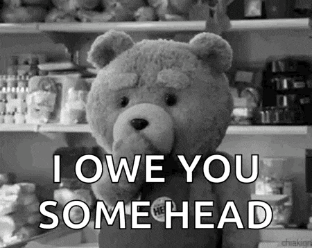 a teddy bear is standing in front of a shelf in a store and saying `` i owe you some head '' .