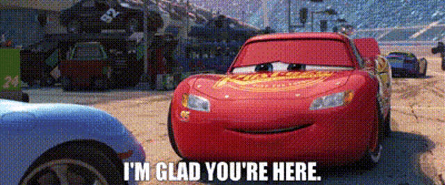 lightning mcqueen from the movie cars is standing next to a blue car .