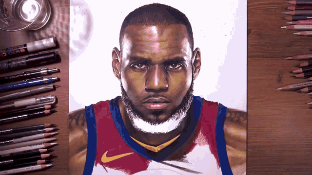 a drawing of lebron james is surrounded by pencils and pens