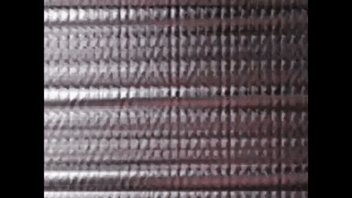 a close up of a piece of metal with a pattern on it