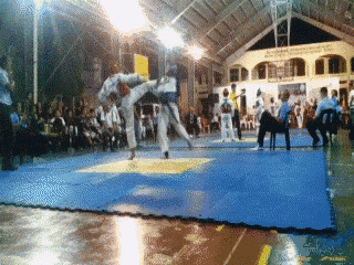 a karate match is being played in a gym