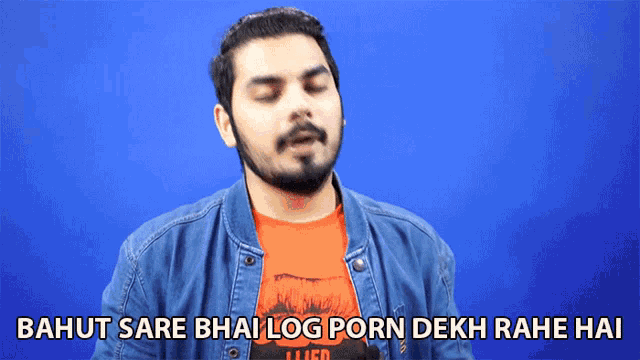 a man wearing a denim jacket and an orange shirt says bahut sare bhai log porn dekh rahe hai